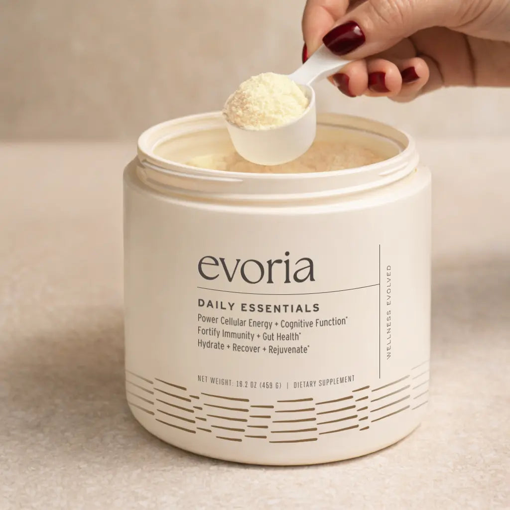 One scoop of Evoria Daily Essentials powder measured from the container