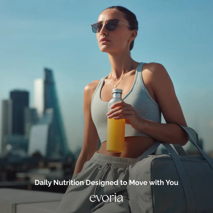 Evoria active lifestyle image of a woman carrying a gym bag and a bottle of daily nutrition drink mix.