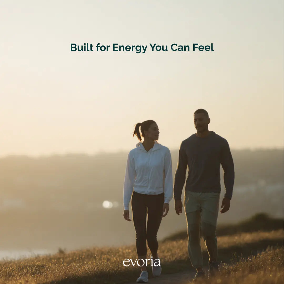 Evoria lifestyle image of an active couple walking outdoors during golden hour, emphasizing everyday vitality.