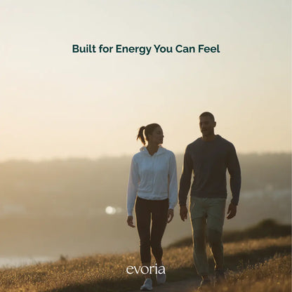 Evoria lifestyle image of an active couple walking outdoors during golden hour, emphasizing everyday vitality.