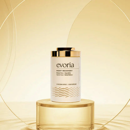 Evoria Night Recovery sleep supplement bottle with gold cap on gold pedestal